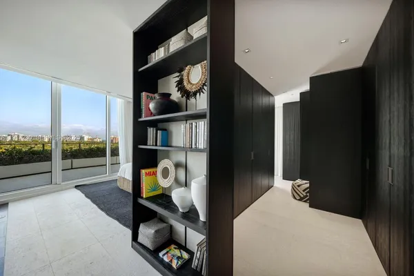 a bedroom with bunk bed and a window