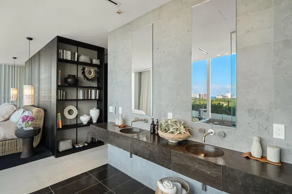 a bathroom with a sink double vanity and a shower