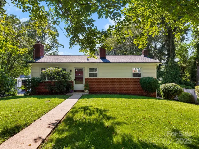 a view of a house with a yard porch and sitting area
