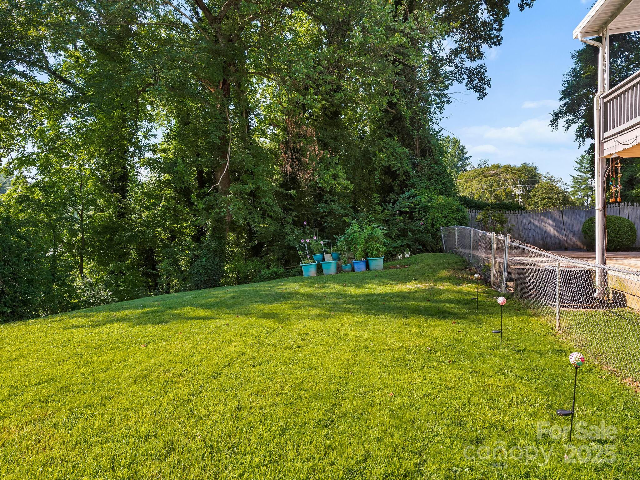 8 Vista Knoll Road Candler, NC 28715 - Photo 23 of 32 a view of a swimming pool with a big yard and large trees