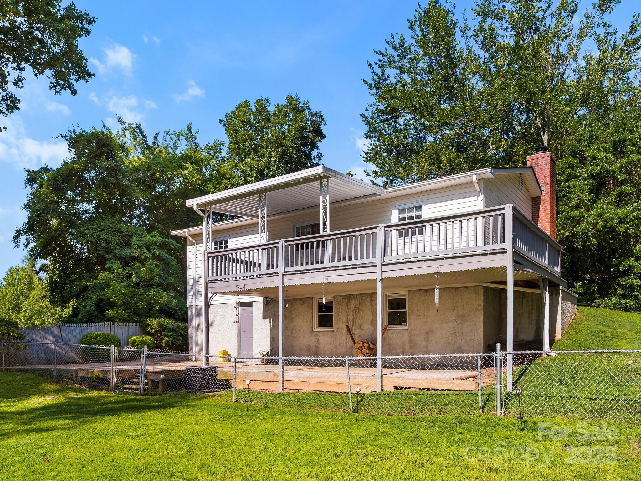 8 Vista Knoll Road Candler, NC 28715 - Photo 25 of 32 a view of a house with a yard
