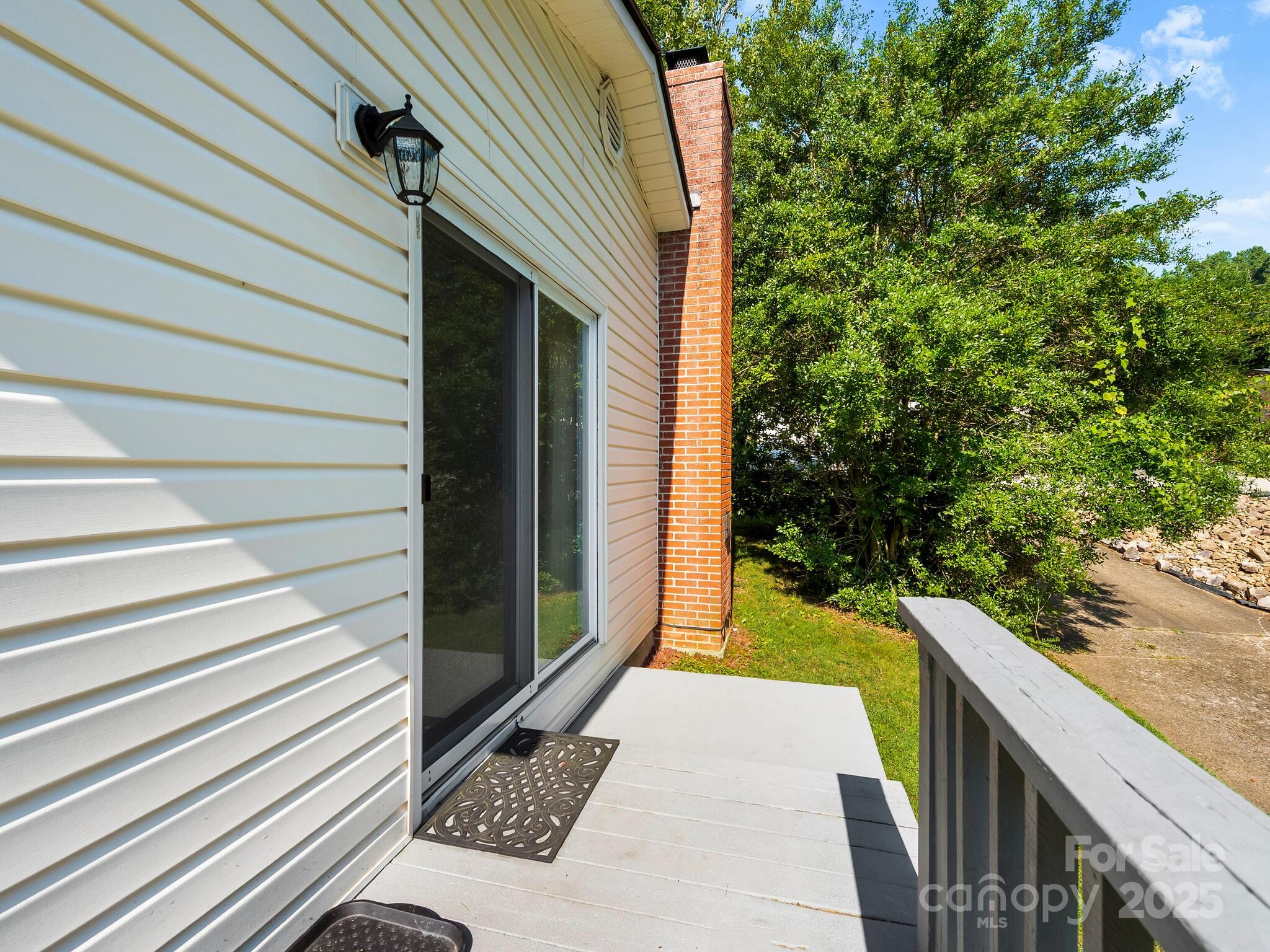 8 Vista Knoll Road Candler, NC 28715 - Photo 29 of 32 a view of a back yard of the house