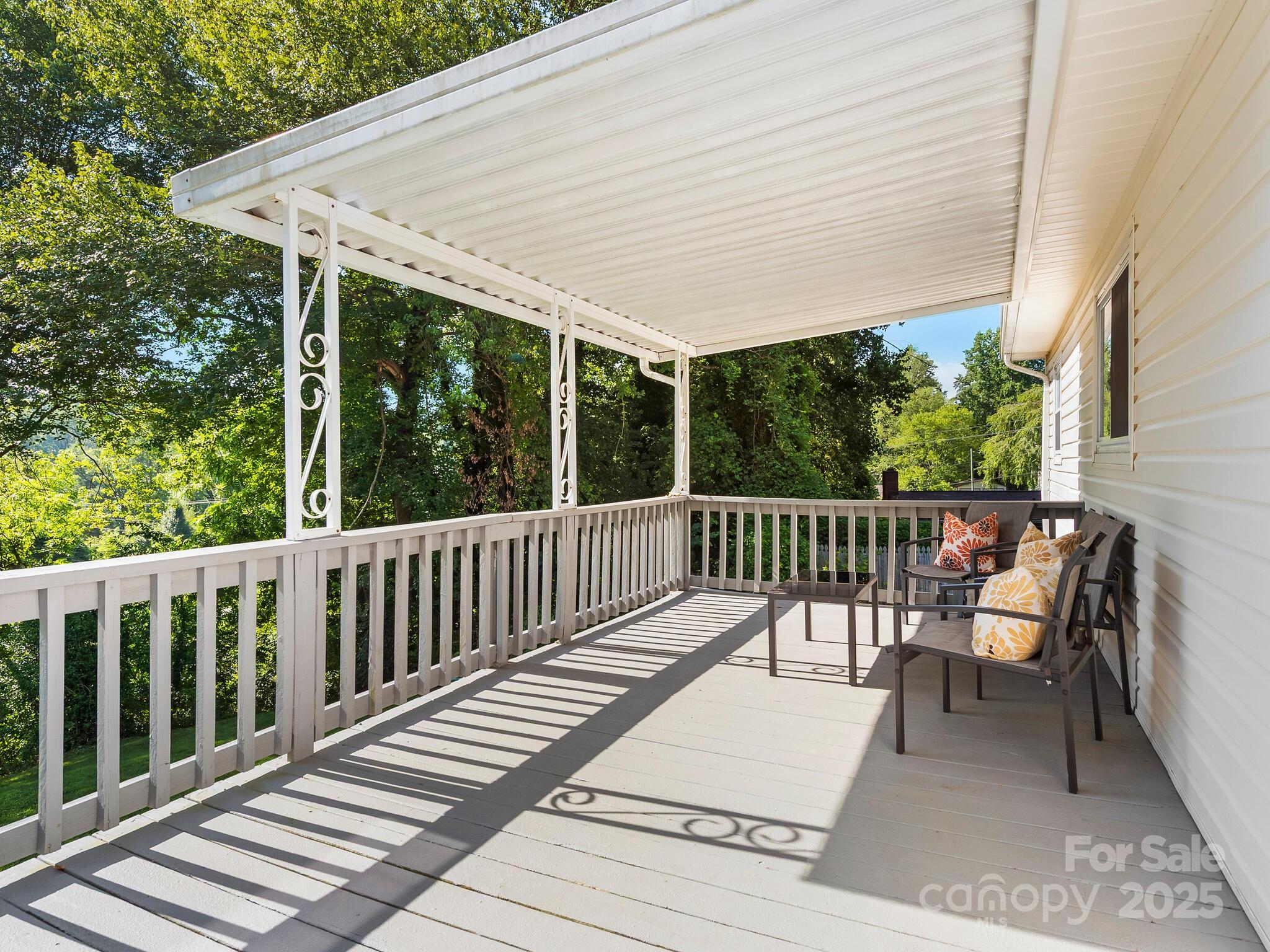 8 Vista Knoll Road Candler, NC 28715 - Photo 30 of 32 a view of a two chairs and table in the balcony