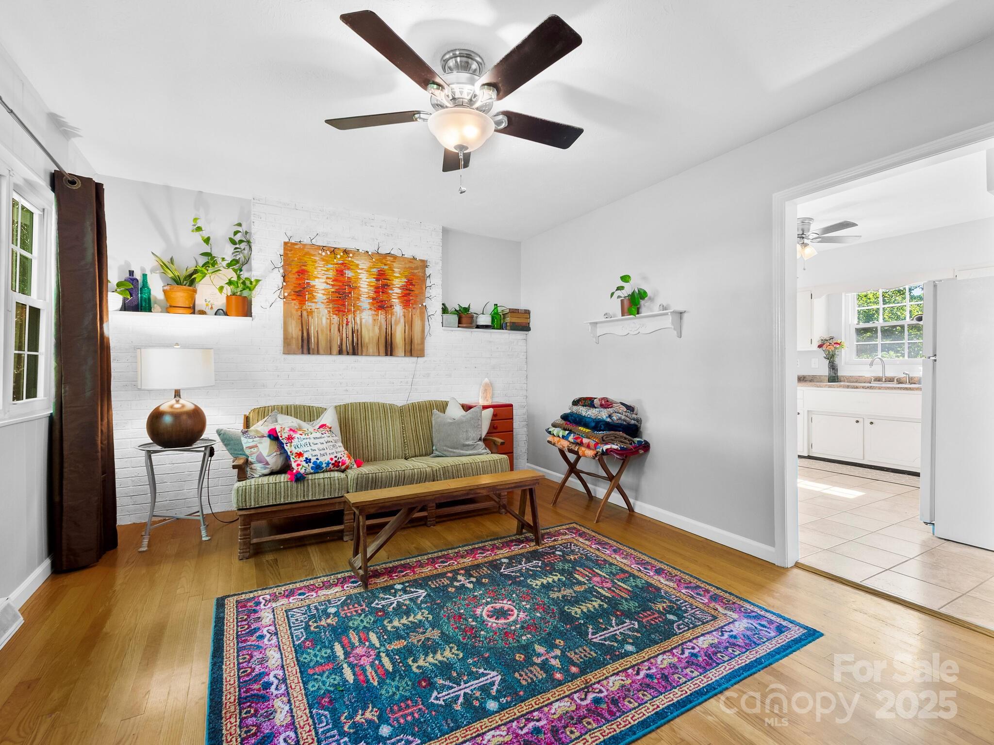 8 Vista Knoll Road Candler, NC 28715 - Photo 3 of 32 a living room with furniture and a rug