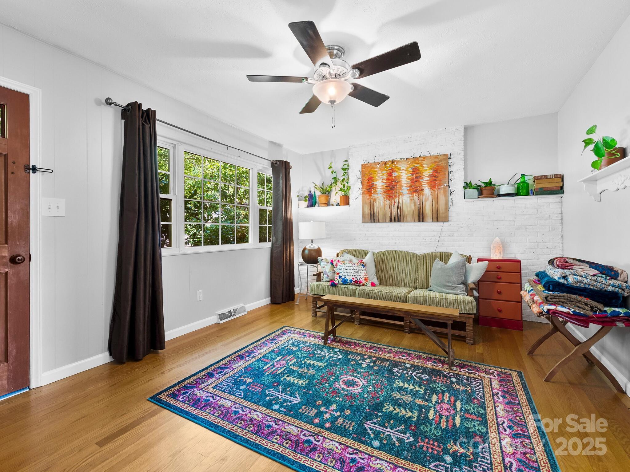 8 Vista Knoll Road Candler, NC 28715 - Photo 4 of 32 a living room with furniture and a rug