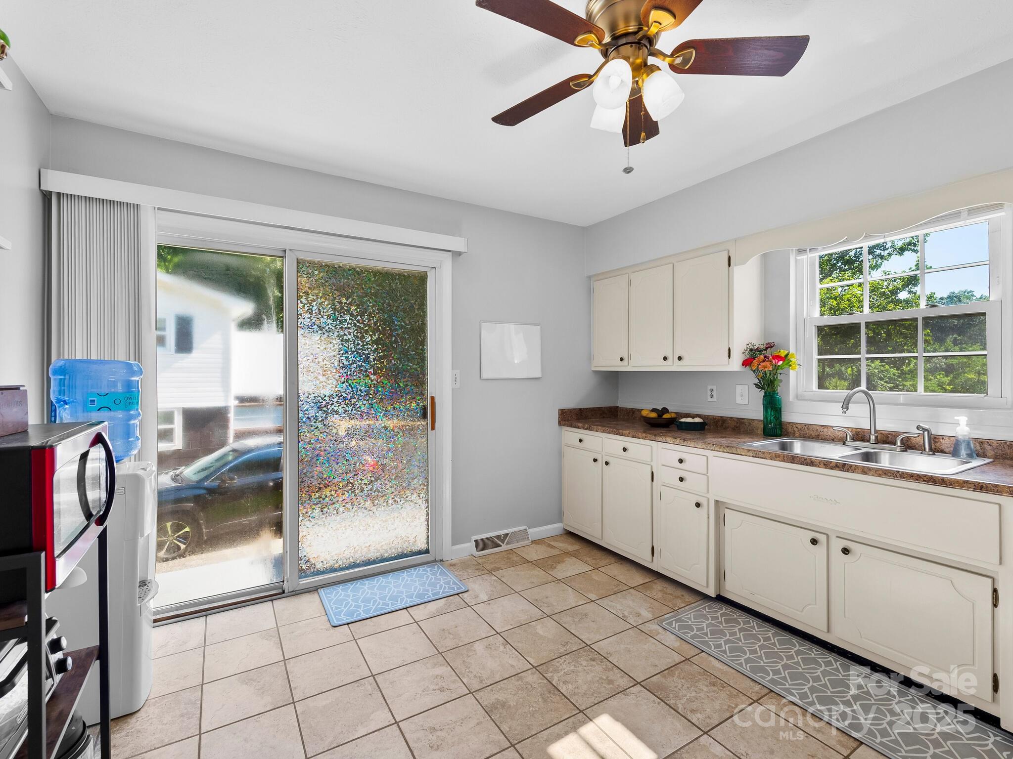 8 Vista Knoll Road Candler, NC 28715 - Photo 8 of 32 a kitchen with a sink a counter top space and appliances