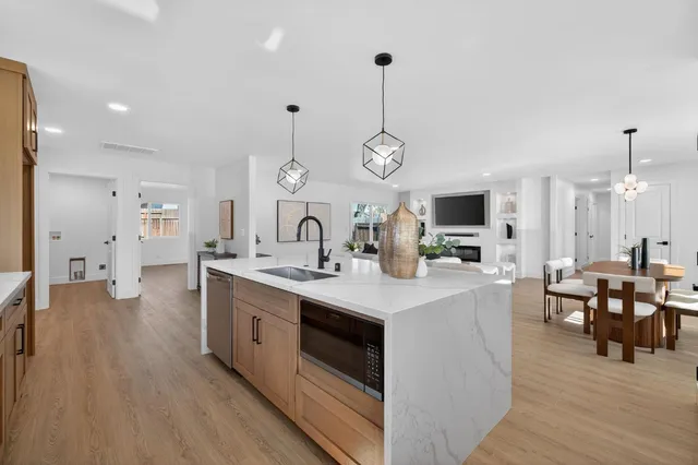 a view of living room with granite countertop furniture and fireplace