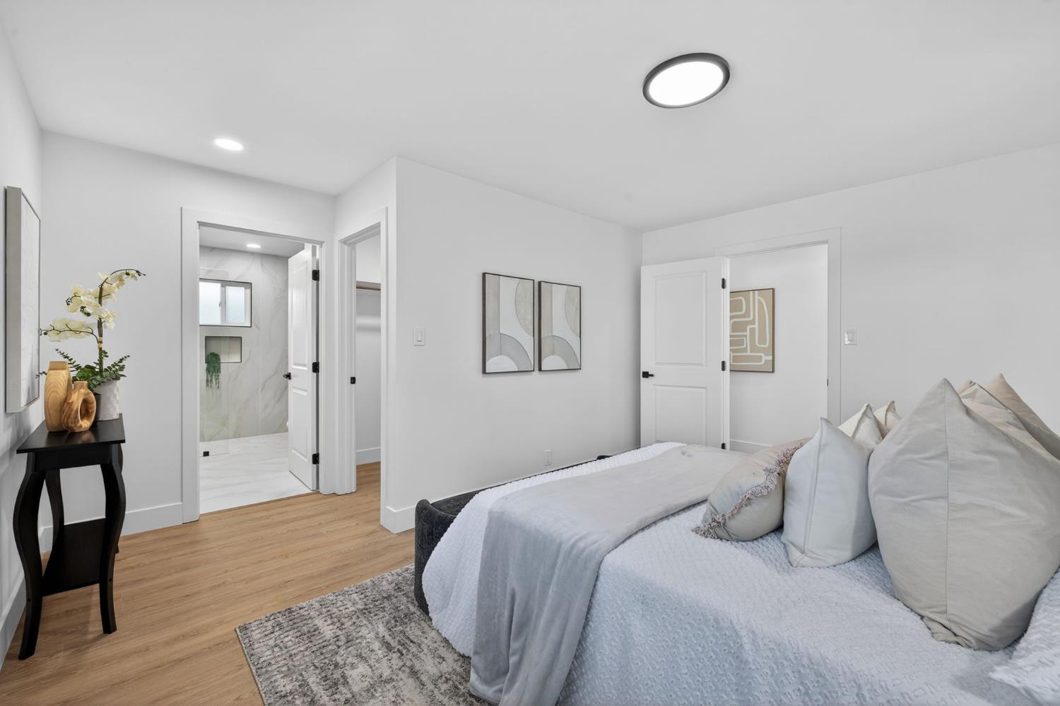 2546 El Vita Way Carmichael, CA 95608 - Photo 25 of 52 a bedroom with a bed and a chandelier