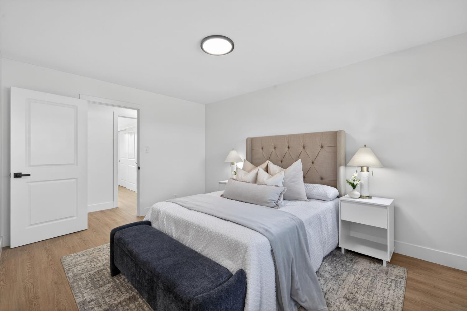 2546 El Vita Way Carmichael, CA 95608 - Photo 26 of 52 a bedroom with a bed and wooden floor