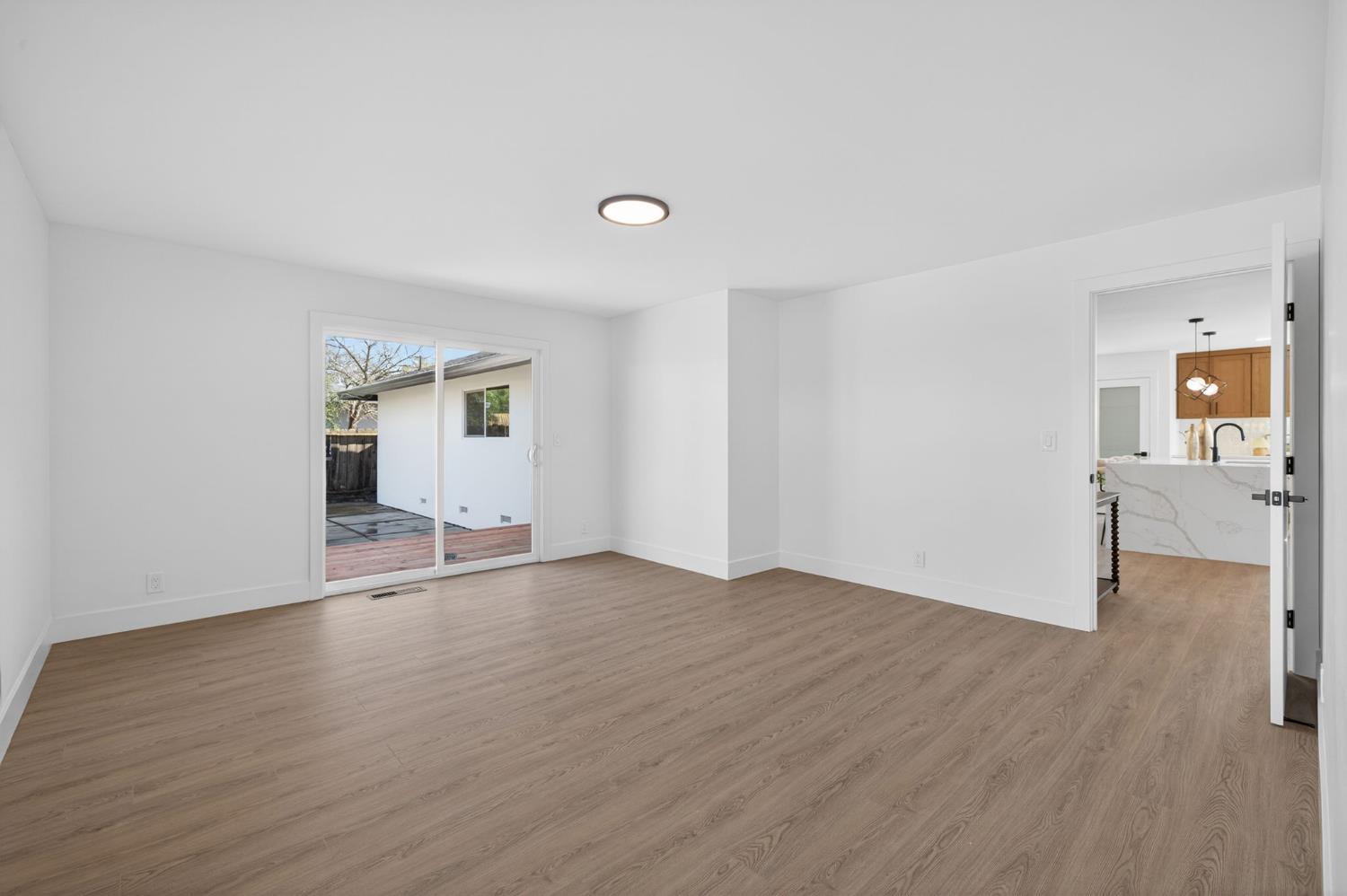 2546 El Vita Way Carmichael, CA 95608 - Photo 28 of 52 an empty room with wooden floor and dining room