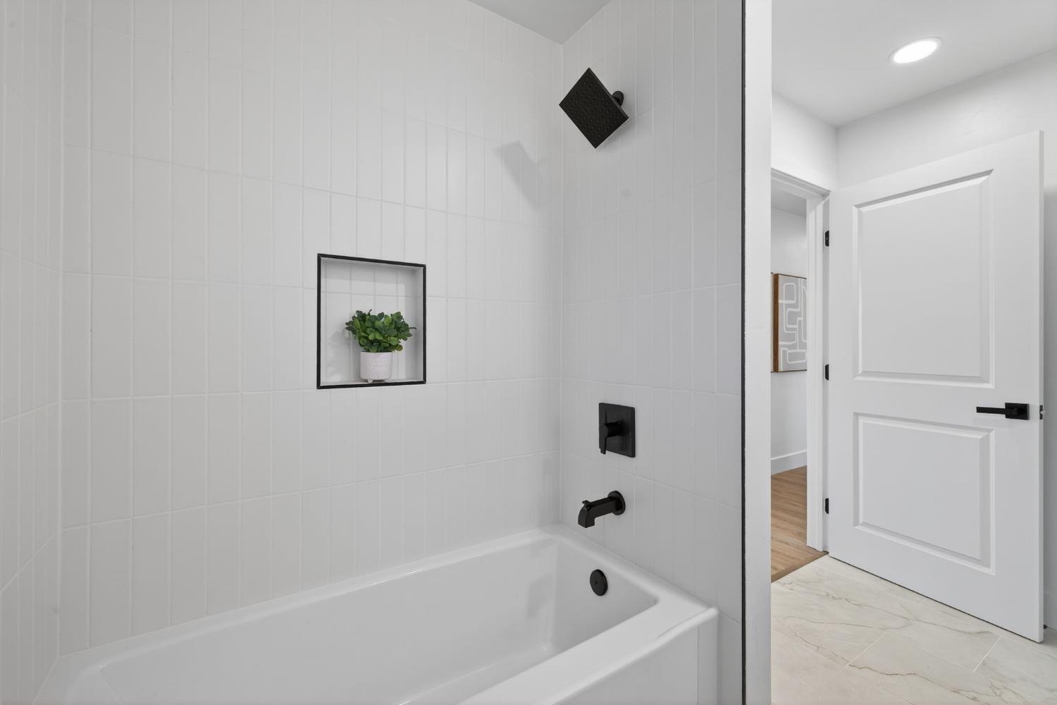 2546 El Vita Way Carmichael, CA 95608 - Photo 34 of 52 a bathroom with a bathtub and a shower