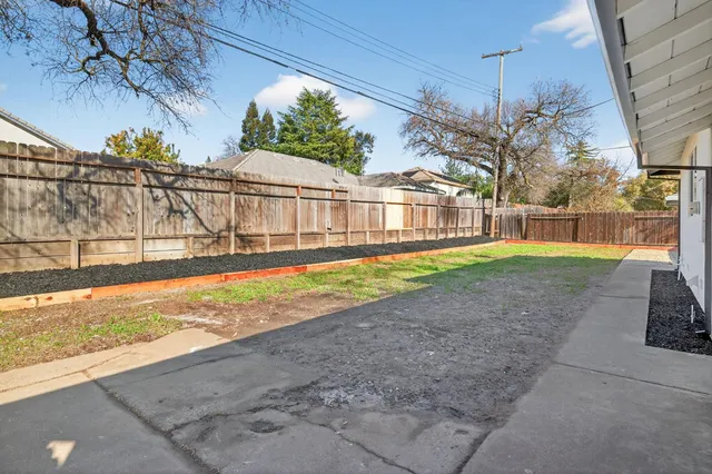 a view of a backyard with a small cabin