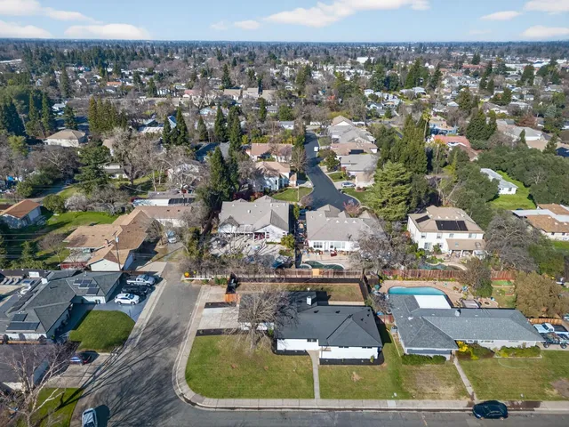 an aerial view of residential houses with outdoor space