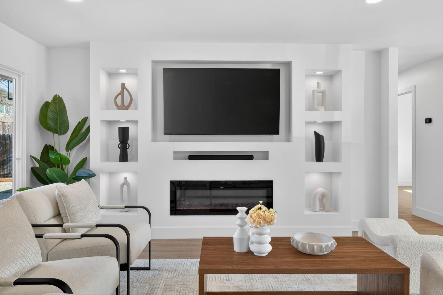 2546 El Vita Way Carmichael, CA 95608 - Photo 10 of 52 a living room with furniture a fireplace and a flat screen tv