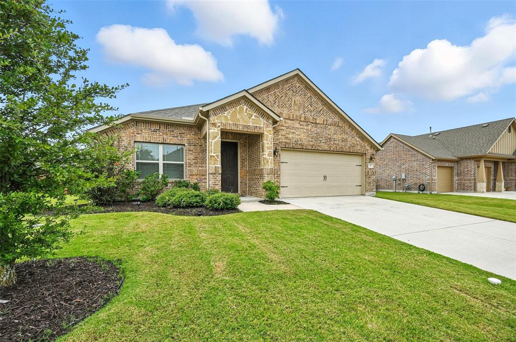 5 Pheasant Run Sanger, TX 76266 - Photo 3 of 27 View of front of property featuring brick siding, concrete driveway, and a front yard