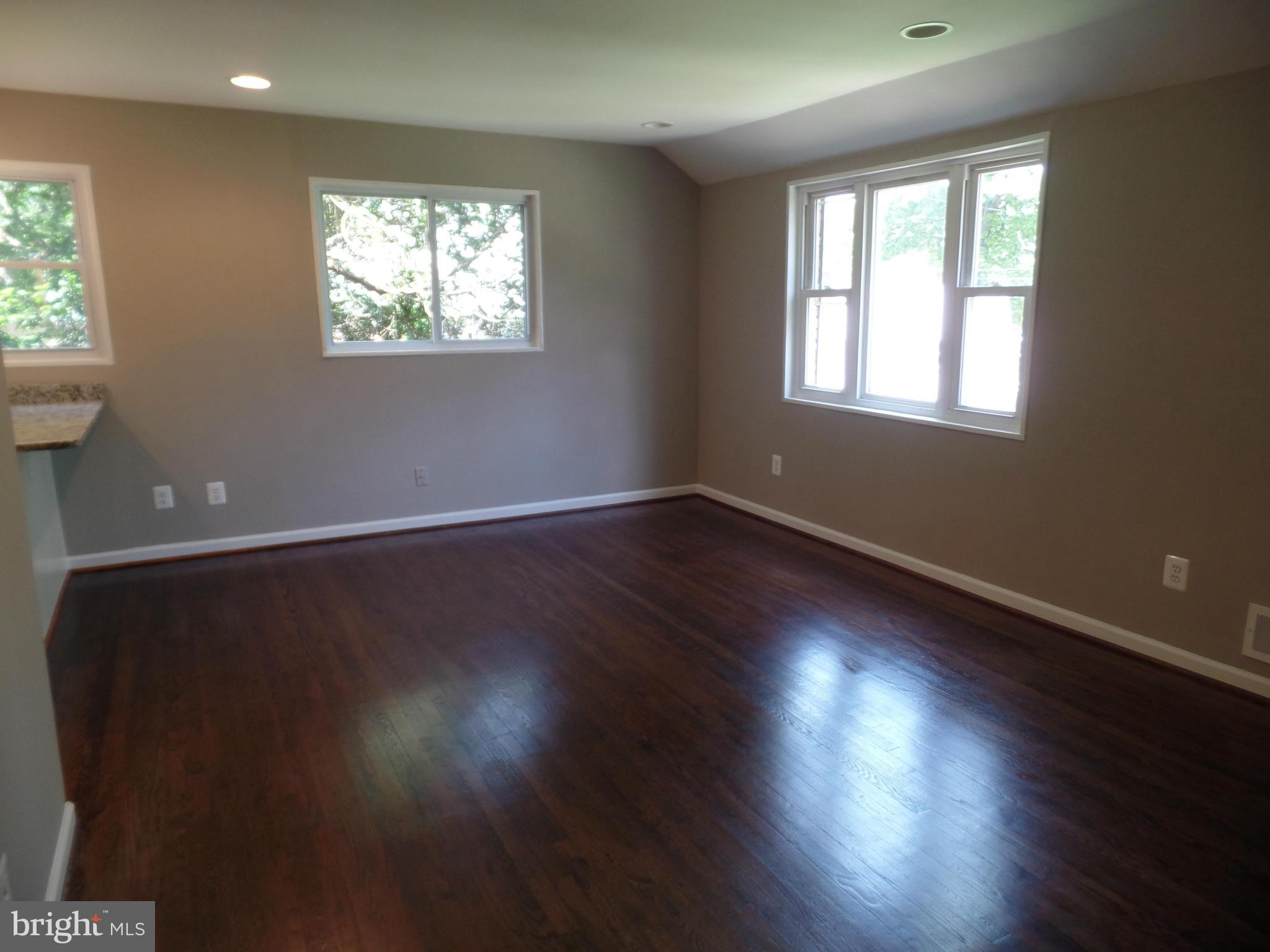 2822 Denley Place Silver Spring, MD 20906 - Photo 9 of 18 an empty room with wooden floor and windows