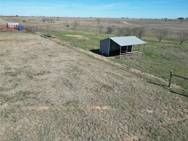 a view of a backyard of the house
