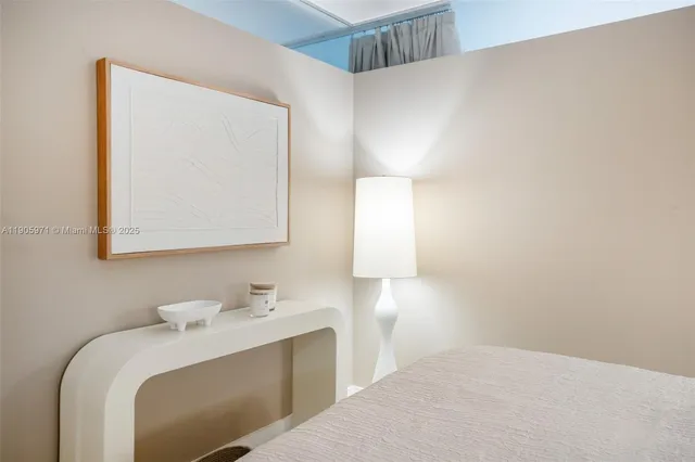 a en suite bathroom with a sink and mirror