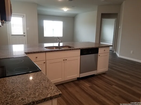 a kitchen with a stove and a microwave