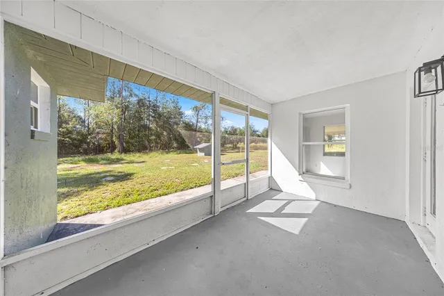 a view of an empty room and window