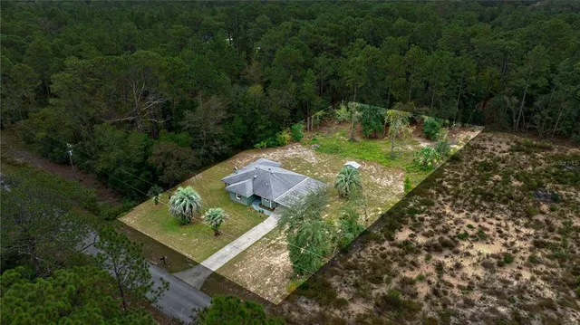 a view of a garden with a patio