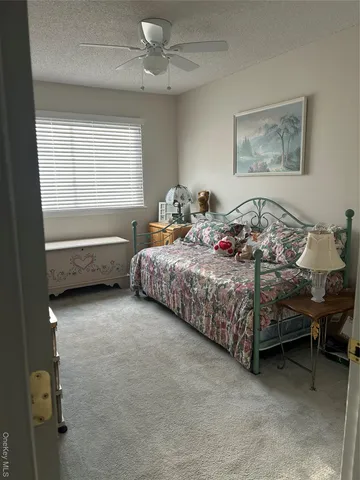 a bedroom with bed and a window