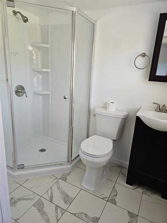 20805 Sheldon Street Orlando, FL 32833 - Photo 10 of 18 a bathroom with a toilet and a shower