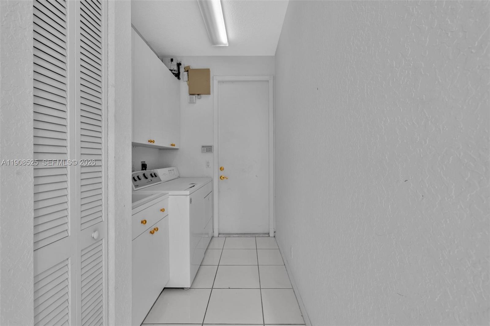 18579 Harbor Light Way Boca Raton, FL 33498 - Photo 20 of 30 a kitchen with cabinets and window