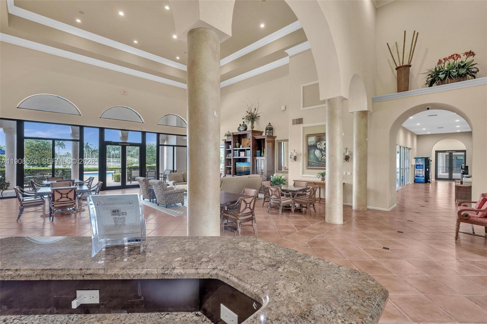 18579 Harbor Light Way Boca Raton, FL 33498 - Photo 27 of 30 a kitchen with counter top space and windows