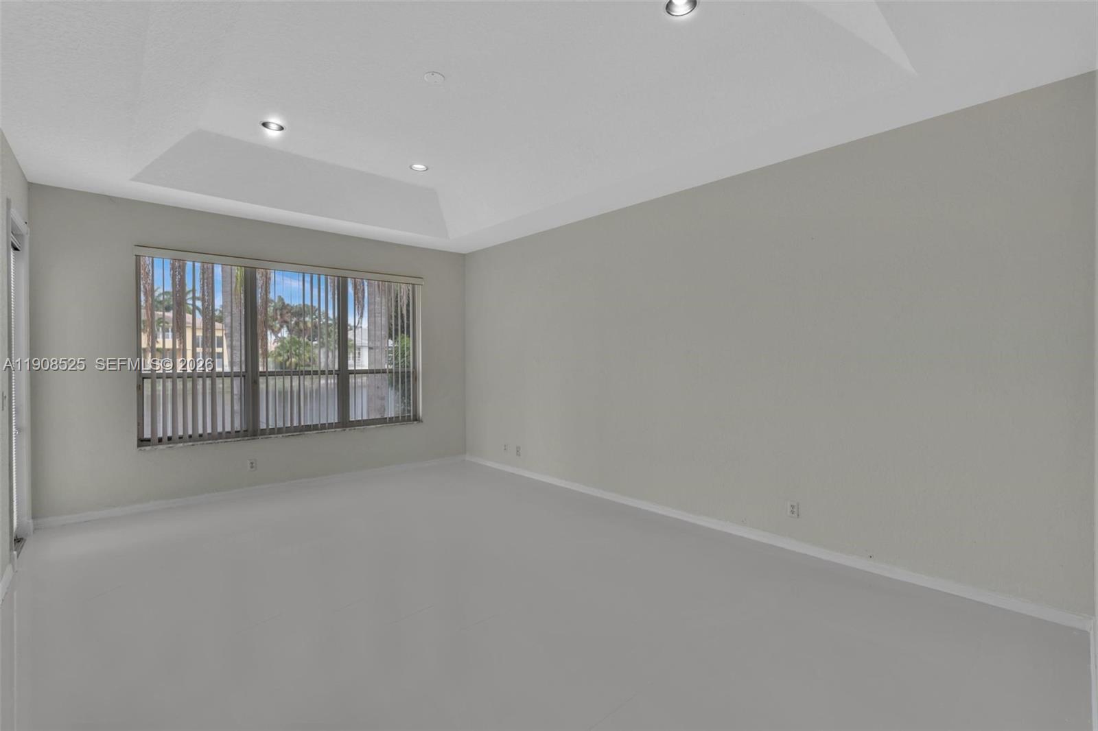 18579 Harbor Light Way Boca Raton, FL 33498 - Photo 9 of 30 wooden floor in an empty room with a window