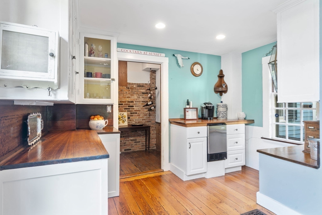 100 Eliot Street Natick, MA 01760 - Photo 12 of 41 a kitchen with stainless steel appliances a stove top oven a sink a counter space and cabinets