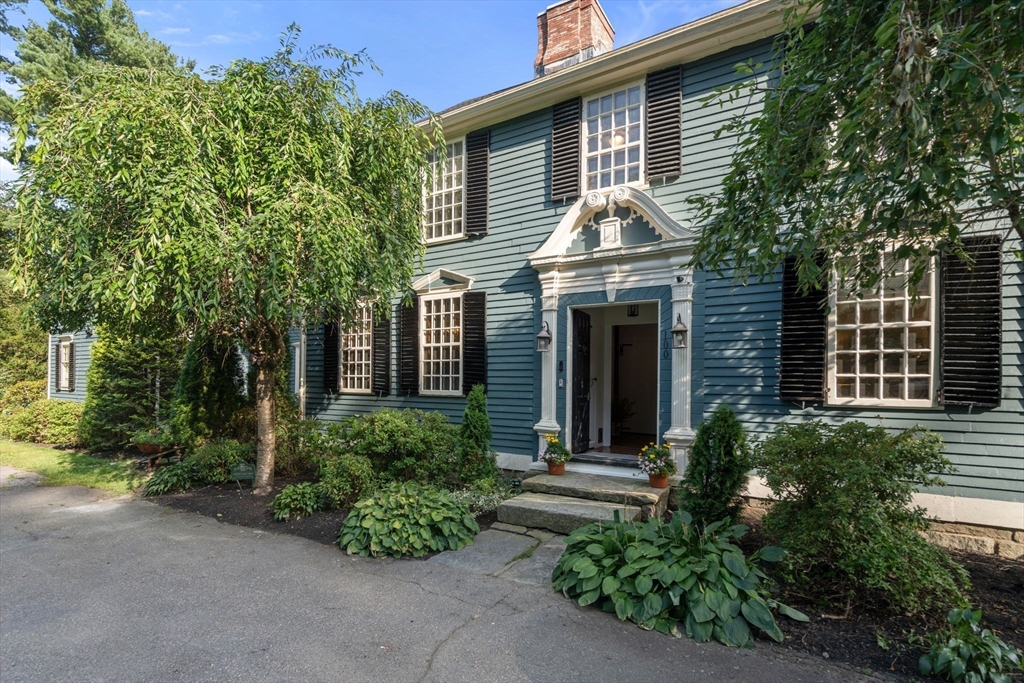 100 Eliot Street Natick, MA 01760 - Photo 2 of 41 a front view of a house with garden