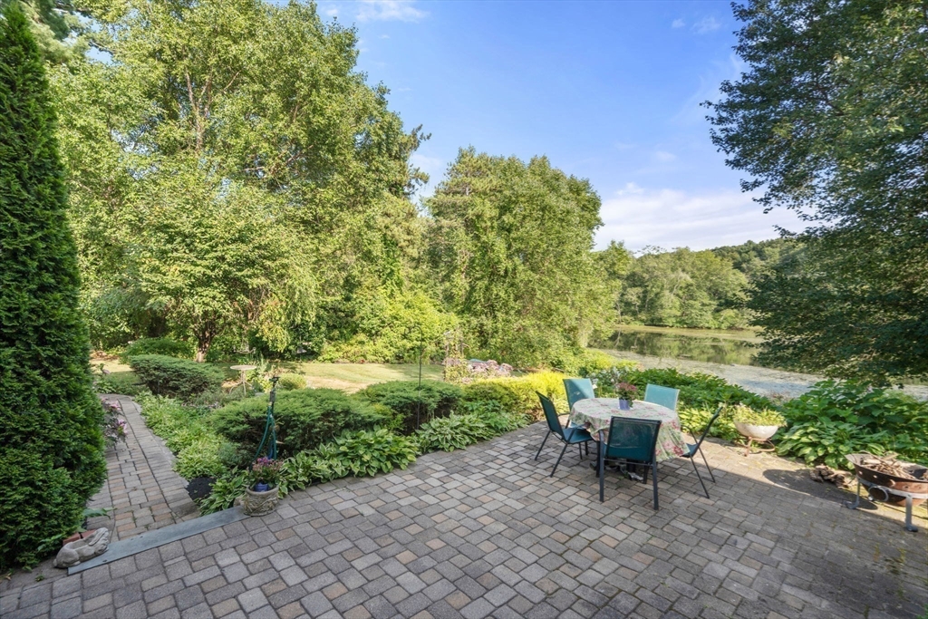 100 Eliot Street Natick, MA 01760 - Photo 36 of 41 a view of a chair and tables in the garden