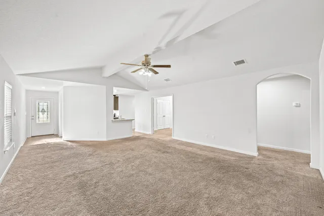 a view of an empty room with a window