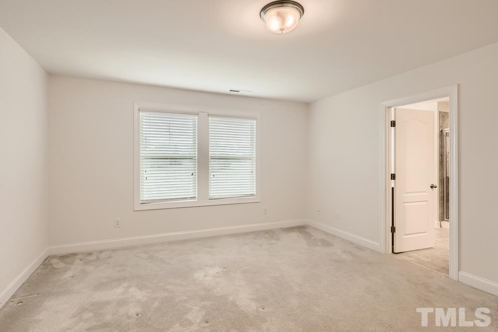 1207 Catch Fly Lane Durham, NC 27713 - Photo 14 of 28 an empty room with a window