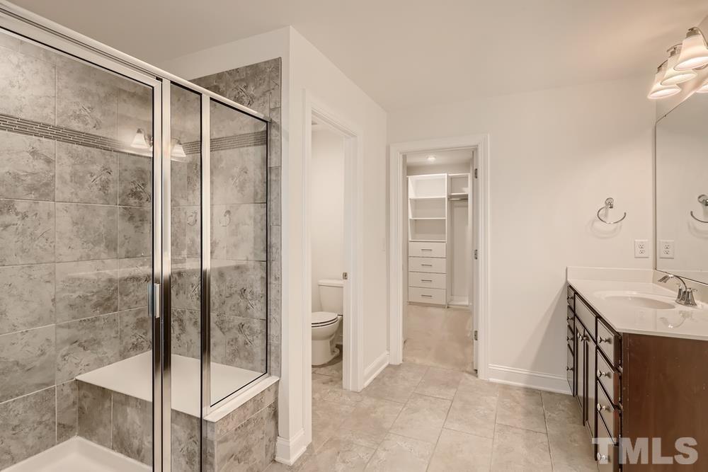 1207 Catch Fly Lane Durham, NC 27713 - Photo 17 of 28 a bathroom with a shower and a sink