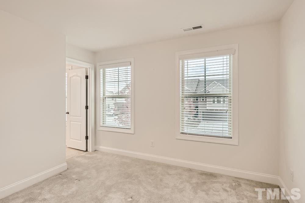1207 Catch Fly Lane Durham, NC 27713 - Photo 19 of 28 a view of an empty room with a window
