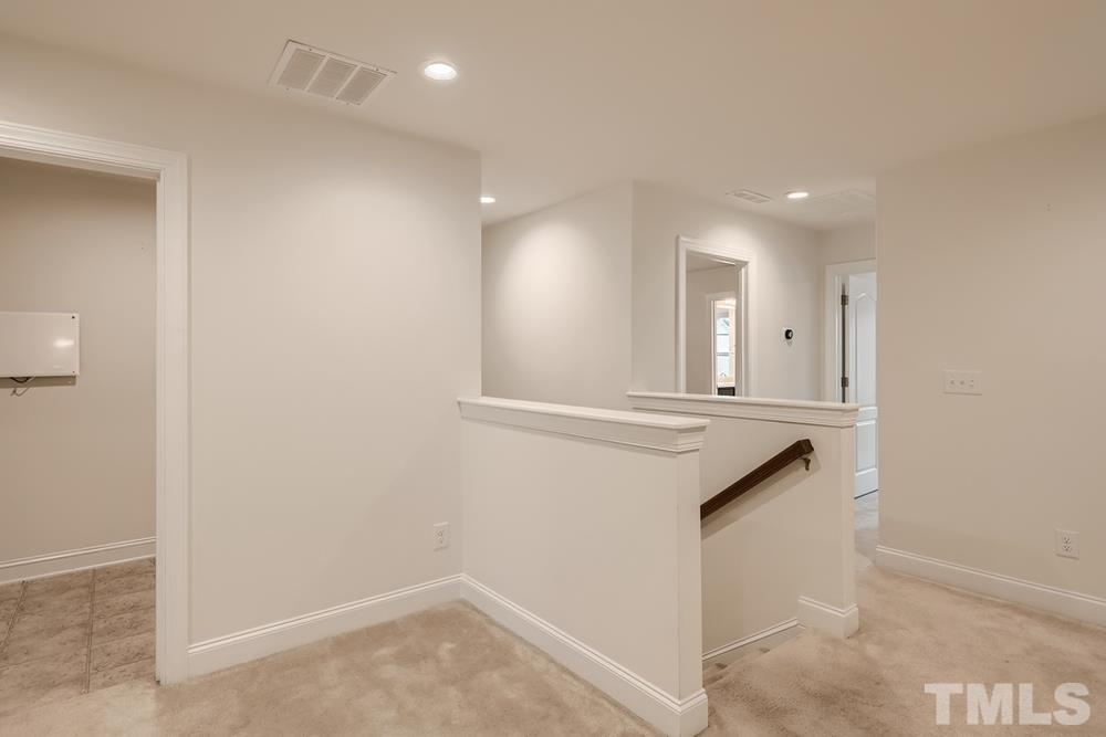 1207 Catch Fly Lane Durham, NC 27713 - Photo 21 of 28 a view of entryway with kitchen island