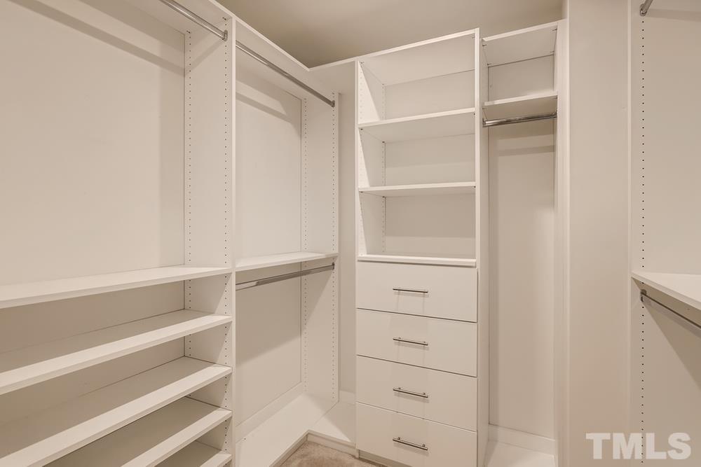 1207 Catch Fly Lane Durham, NC 27713 - Photo 24 of 28 a view of walk in closet with empty racks
