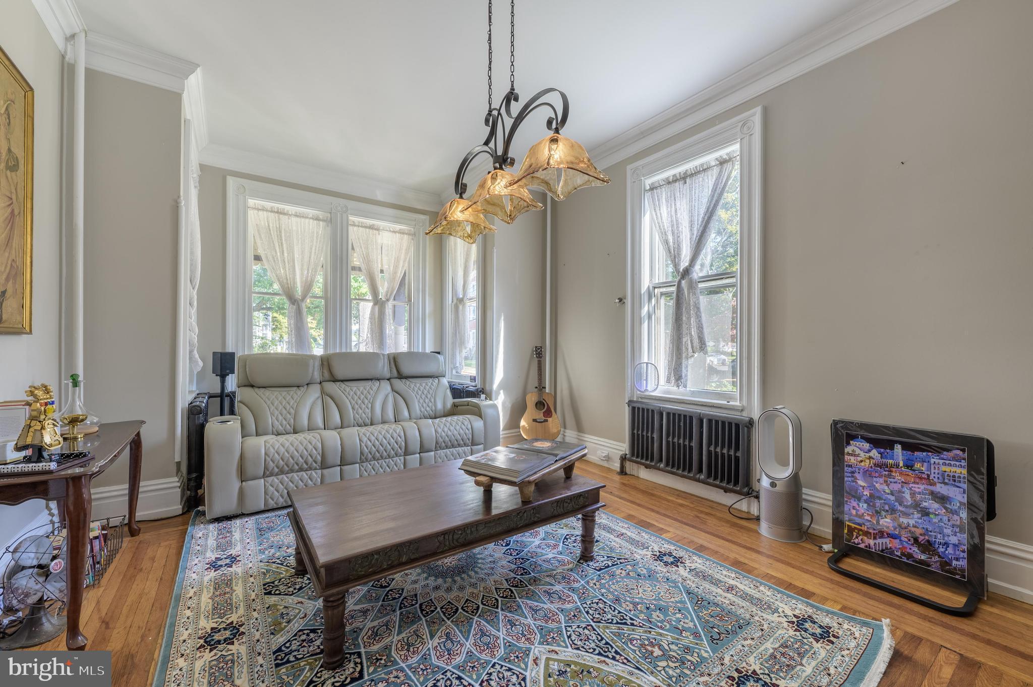 48 Broad Street Mount Holly, NJ 08060 - Photo 12 of 63 a living room with furniture a rug and a window
