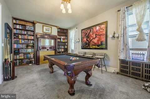 a view of a room that has a couch and a table in it