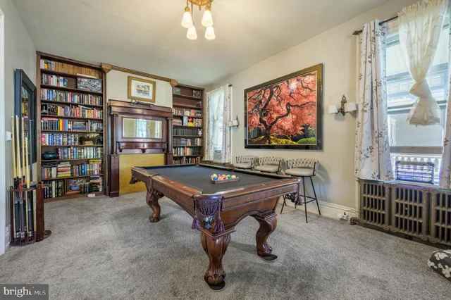 a view of a room that has a couch and a table in it