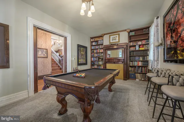 a view of a livingroom with furniture window and wooden floor