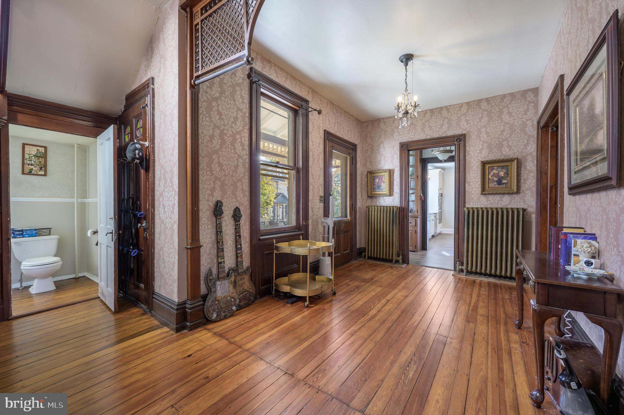 48 Broad Street Mount Holly, NJ 08060 - Photo 19 of 63 a view of a livingroom with furniture window and wooden floor