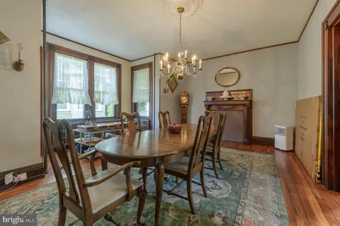 a kitchen with stainless steel appliances granite countertop a lot of counter space and wooden floor