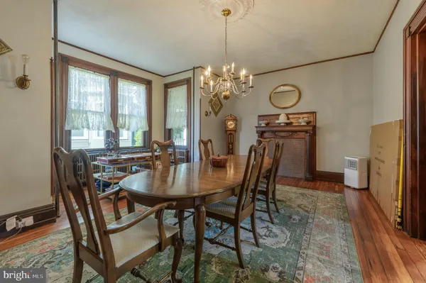 a kitchen with stainless steel appliances granite countertop a lot of counter space and wooden floor