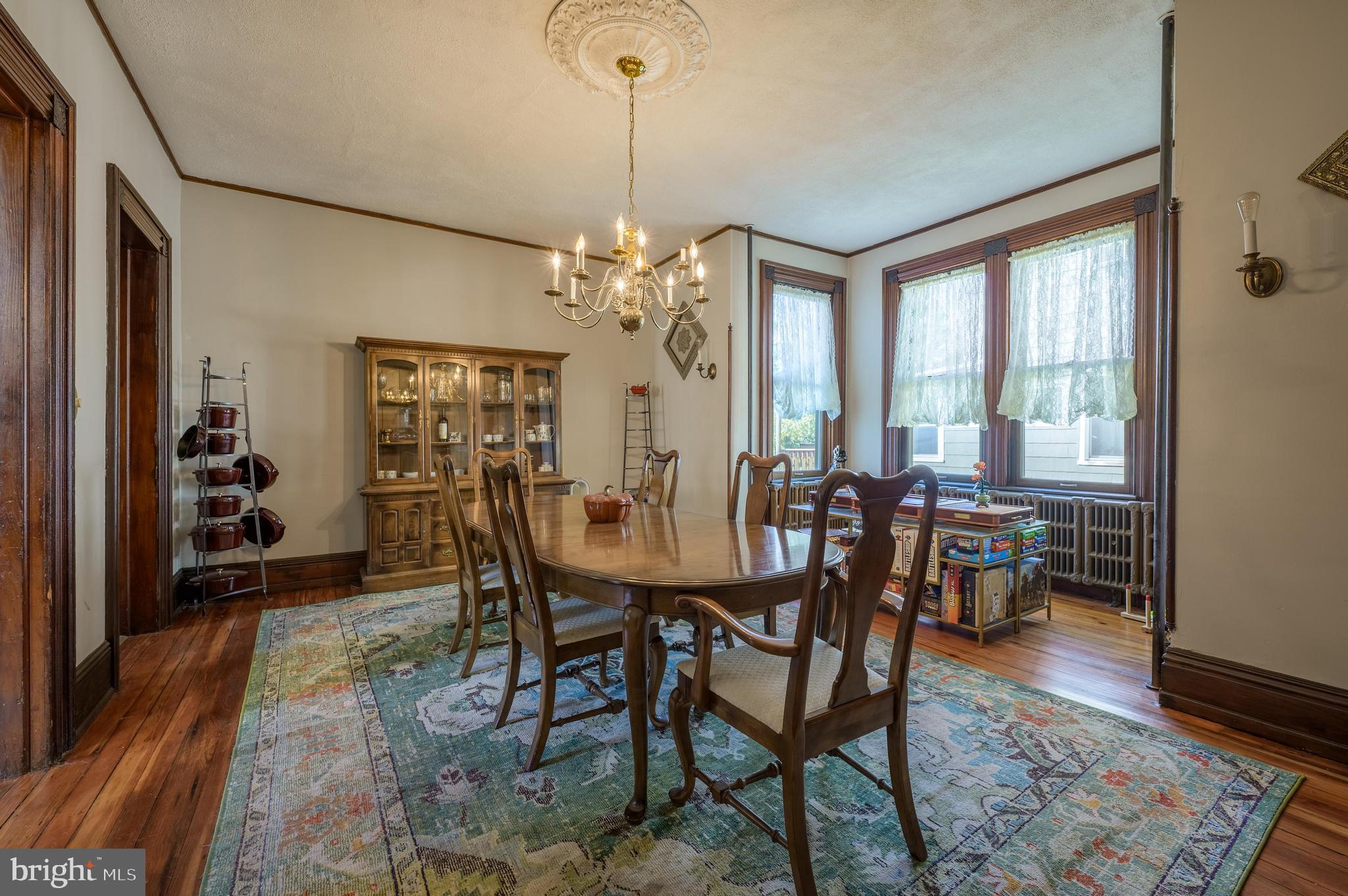 48 Broad Street Mount Holly, NJ 08060 - Photo 21 of 63 a view of a dining room with furniture window and wooden floor