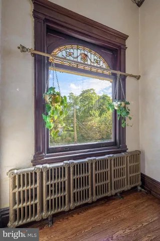 a spacious bedroom with a bed and a ceiling fan