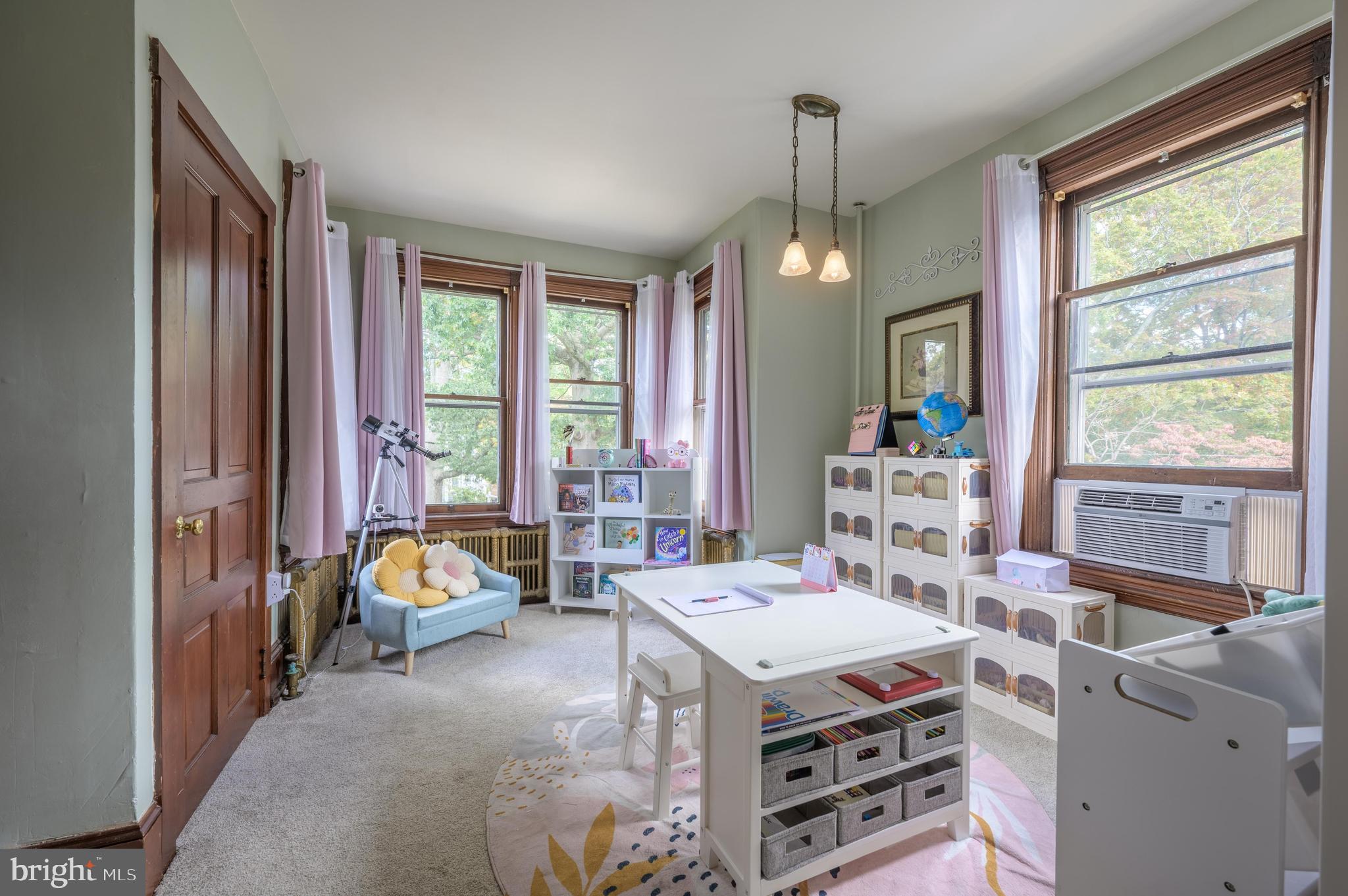 48 Broad Street Mount Holly, NJ 08060 - Photo 33 of 63 a bed room with a bed and a chandelier