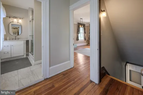 a house view with swimming pool in front of it